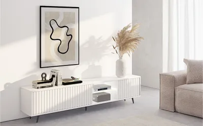 Produktbild von Selsey Bello Lowboard, Weiß, mit LED, Lamellen und 4 Fächern (3 geschlossen, 1 offen), Kabelöffnungen, aus MDF mit PVC-Folie und Stahl, B 175 x H 43.5 x T 31.3 cm