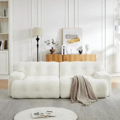 Produktbild von Cloud Sofa, übergroßer Zweisitzer – Breite Armlehnen und modernes Design mit Knopfverzierung. Geschwungenes Sofa