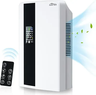 A white dehumidifier with a black accent panel and a digital display, shown with a remote control and a graphic representation of air flow and leaves.