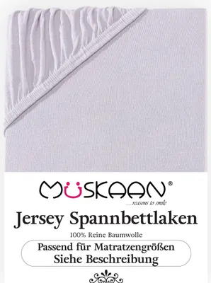 A close-up view of a light gray jersey fitted sheet, folded and showing the elasticized corner.