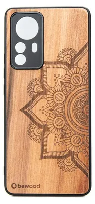 A wooden phone case with a mandala design.