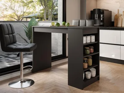 A modern kitchen or dining area with a bar table and stool.