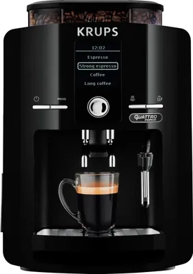 A black Krups coffee machine with a cup of espresso in the foreground.
