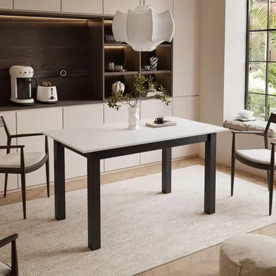 A dining table set in a modern kitchen or dining area.
