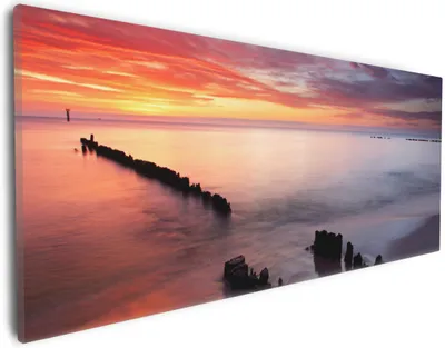 Produktbild von Wallario Premium Leinwandbild Sandstrand im Sonnenuntergang - Roter Himmel in Größe 30 x 75 cm