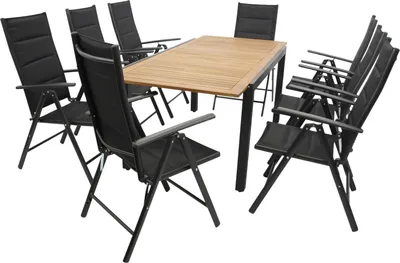 A garden dining set with a wooden table and black chairs, presented on a white background.