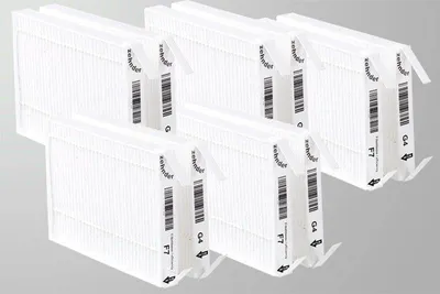 A set of air filters arranged in a staggered formation against a plain background.