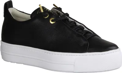A black leather sneaker with a white platform sole is shown against a white background.