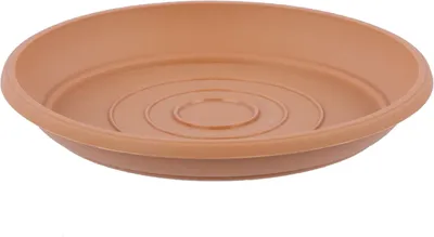 A single terracotta-colored plant saucer is shown from a slightly elevated side angle against a white background.