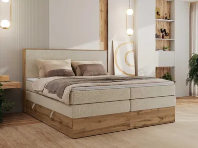 A bedroom scene featuring a large boxspring bed.