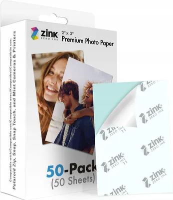 A product box for Zink Premium Photo Paper, with a sample of the paper shown in the foreground.