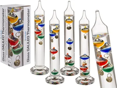 A product shot of multiple Galileo thermometers and their packaging.