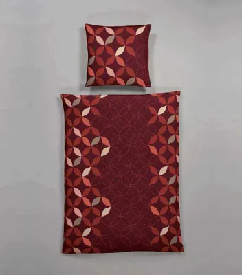 A flat lay of a duvet cover and pillowcase with a geometric pattern.