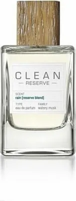 A bottle of Clean Reserve Rain perfume with a wooden cap.
