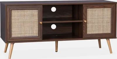 A dark wood TV stand with rattan cane doors and light wood legs, presented against a white background.
