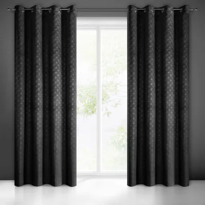 Two black curtains are hung on a curtain rod in front of a window.