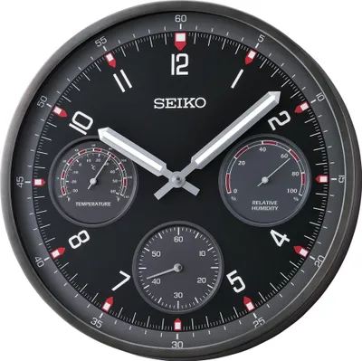 A close-up studio shot of a Seiko wall clock with integrated thermometer and hygrometer.