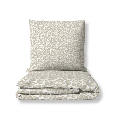 A folded duvet and pillow with a leopard print pattern, presented on a white background.