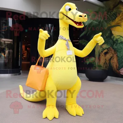Productafbeelding van Citroengeel Brachiosaurus mascotte REDBROKOLY kostuum karakter gekleed met een overhemd en handtassen