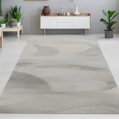 Immagine prodotto di Tappeto in pelliccia di coniglio grigia dall'aspetto elegante e morbido, con un fine luccichio, dimensioni moderne - 120 x 170 cm