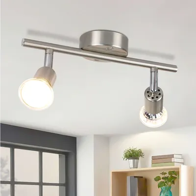 A ceiling light fixture with two adjustable spotlights mounted on a track.