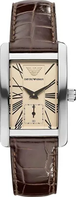 A close-up, front-facing studio shot of an Emporio Armani watch with a brown leather strap and a beige dial with Roman numerals.