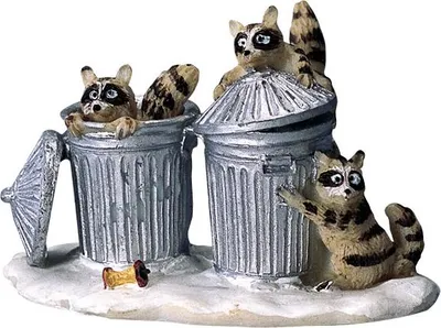 Three raccoons interacting with trash cans.