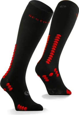 A pair of black knee-high sports socks with red accents, displayed against a white background.