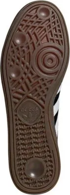 The sole of an Adidas sneaker is shown from an underneath view.