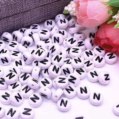 Produktbild von Buchstaben Perlen, 30 Stück, 4x7 mm, weiß mit schwarz, rund, Buchstabe N