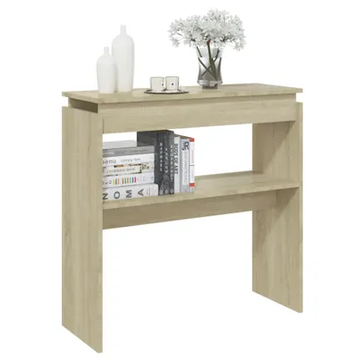A console table with books and decorative items on a white background.