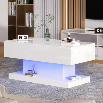 A modern white coffee table with LED lighting in a living room setting.
