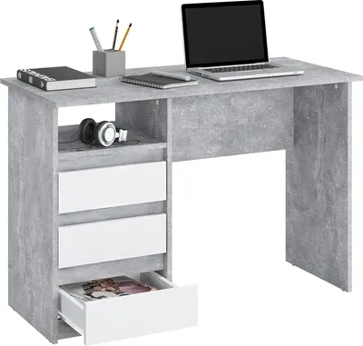A desk with a laptop, headphones, books, and pens.