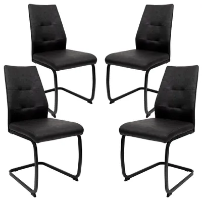 Four black dining chairs on a white background.