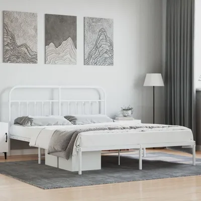 A white metal bed frame with a headboard is shown in a bedroom setting.
