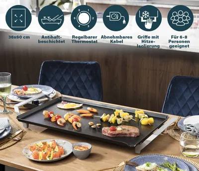 A table set for a meal with an electric grill in the center, featuring various food items.