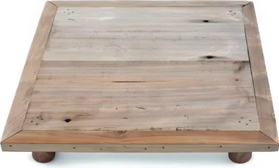A square wooden plant stand with four short legs, viewed from a slightly elevated angle.