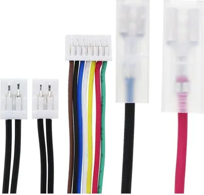 A collection of electronic connectors and wires against a white background.