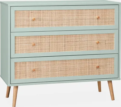 A light green dresser with three rattan-fronted drawers and wooden legs, set against a plain white background.