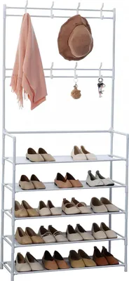 A white metal garment rack with a shoe shelf, displaying a pink scarf, a brown hat, and several pairs of shoes.