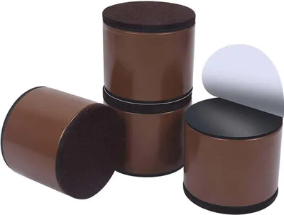 Four brown cylindrical risers with dark brown felt pads on top and bottom.