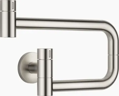 A pot filler faucet mounted on a wall.