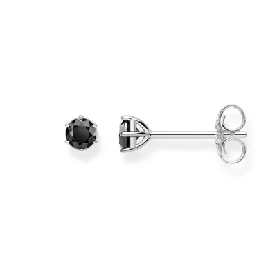 A pair of black stud earrings with silver settings on a white background.