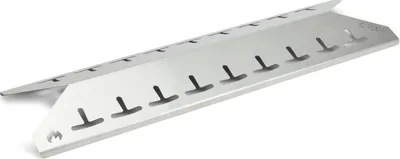 A stainless steel heat shield for a grill.