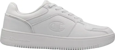 A white Champion Rebound 2.0 Low sneaker is shown from a side-diagonal angle against a white background.