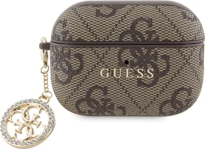 A close-up shot of a brown and beige patterned AirPods Pro 2 case with a gold, rhinestone-embellished charm.