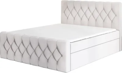 A studio shot of a bed.