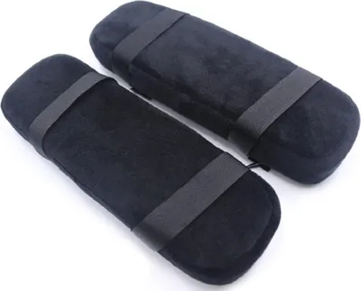 Two black armrest cushions are shown on a white background.
