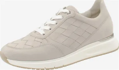A single women's sneaker shown from a side angle against a white background.