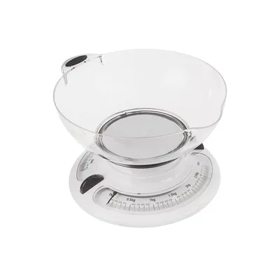 A white mechanical kitchen scale with a clear bowl on a white background.